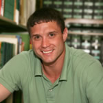 Man in library smiling