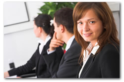 Woman smiling in office meeting