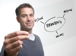 Man holding a transparency of a flow chart