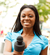Female reporter holding microphone
