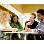 Study group of adult students in a library.