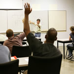Instructor teaches students in a classroom.
