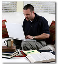 Student studying at laptop at Northwestern College Online
