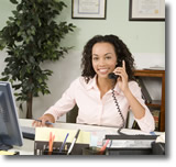 Professional woman at desk on the telephone