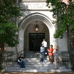 Students and professor in front of Vanderbilt academic hall