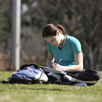 Student reading on Vanderbilt campus